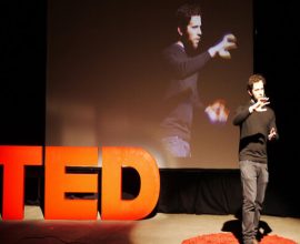 Motivational speech - Inspirational speaker in the middle of motivational TED talks for students