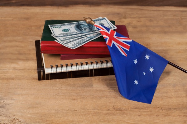 Australian flag and books for Top universities for MS in Australia