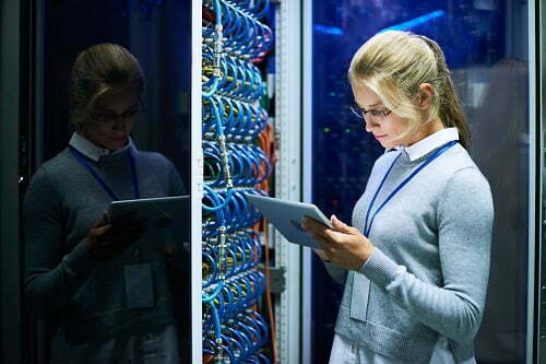 Young Woman Working with Supercomputer