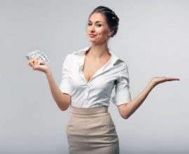 Corporate woman holding money telling you about the Highest paying jobs in the world