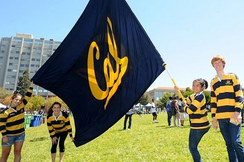 Students waving the UC Berkeley flag