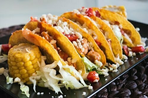 Homemade chicken tacos with corn and cheese