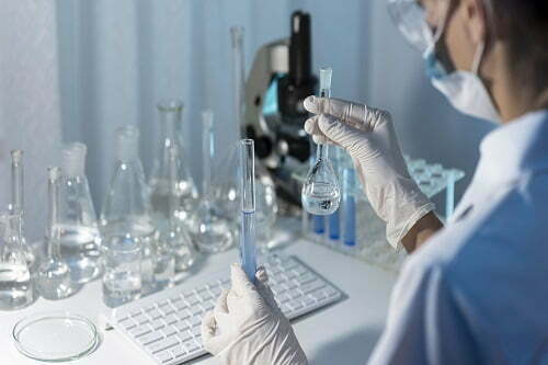 Chemical engineering jobs - a researcher working in the lab, creating solutions for projects.