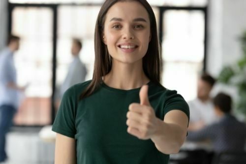 A girl showing positive thumb after AICTE internship registration. 